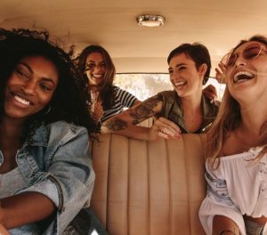 Car with 4 girls inside laughing