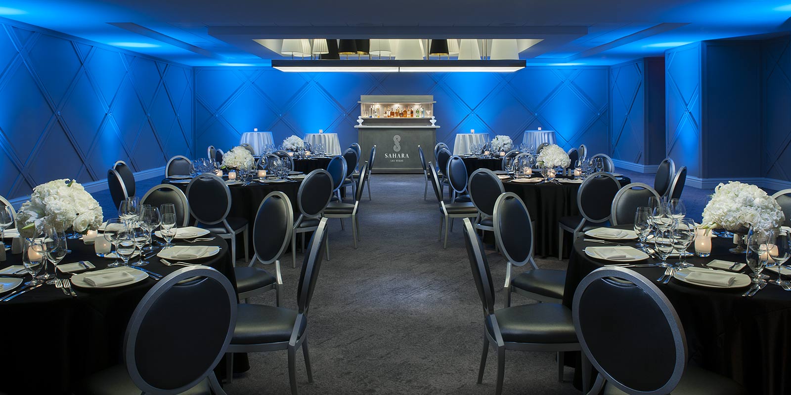 Arranged tables and chairs in the Clyde meeting room at SAHARA Las Vegas