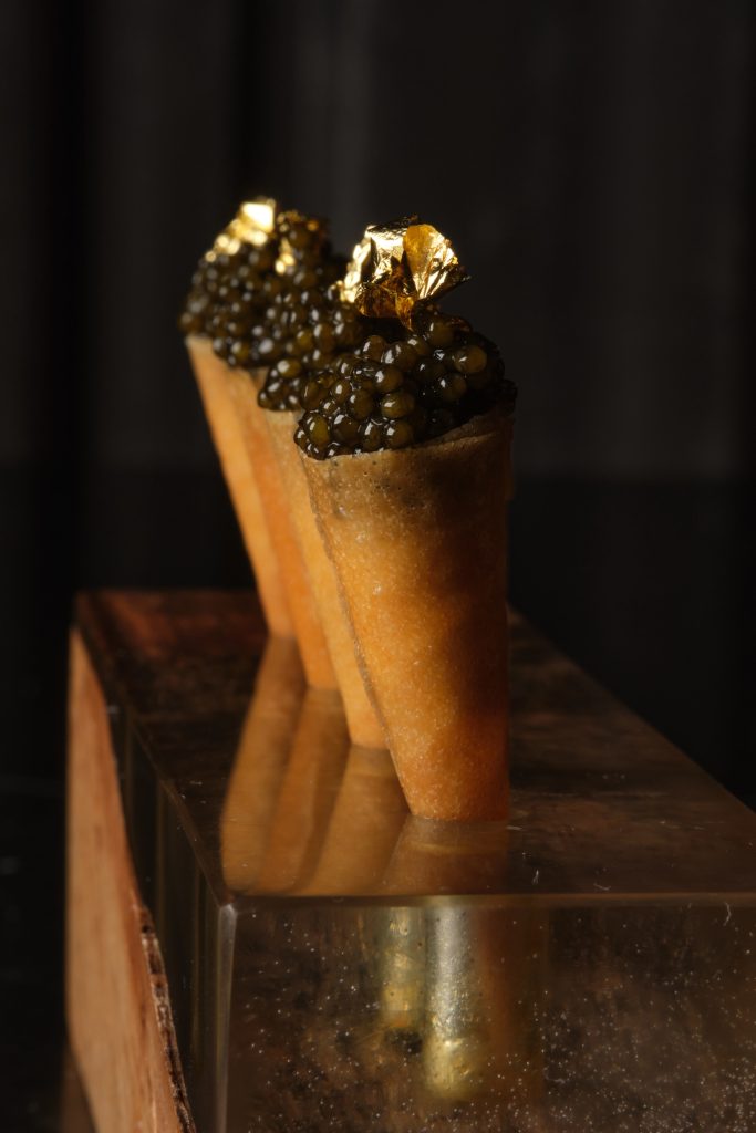 Caviar cones, pastry coned filled to the top with caviar.