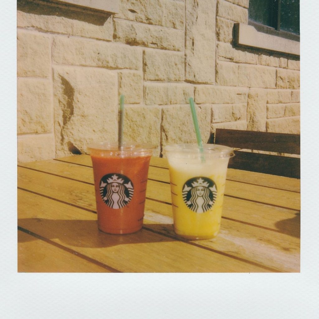 a picture of two Starbucks blended drinks which are yellow and pink in color