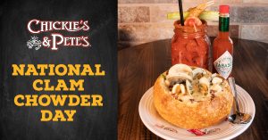 Chickie's & Pete's National Clam Chowder Day Image featuring a bread bowl of clam chowder and a bottle of tabasco