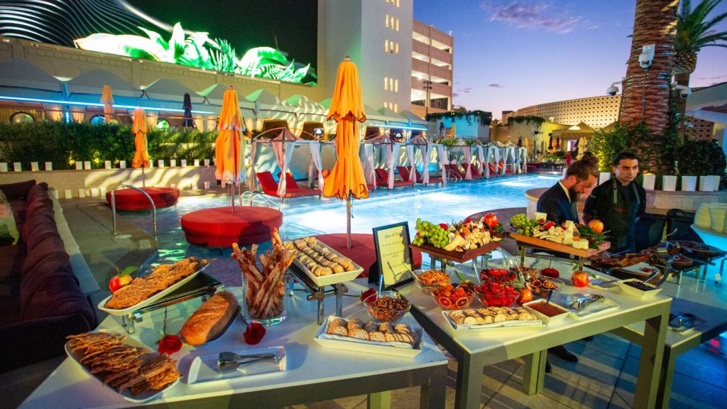 a full banquet spread of food set up at the AZILO Ultra Pool