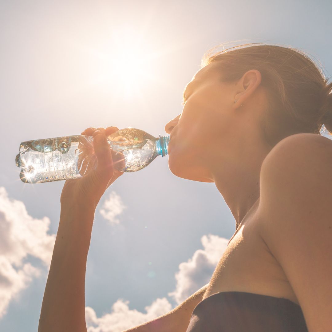 picture of girl drinking water from bottle