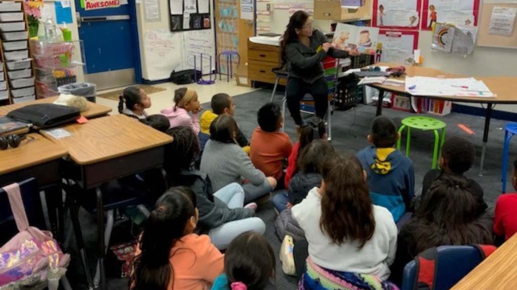 SAHARA Employees reading to students during Nevada Reading Week.