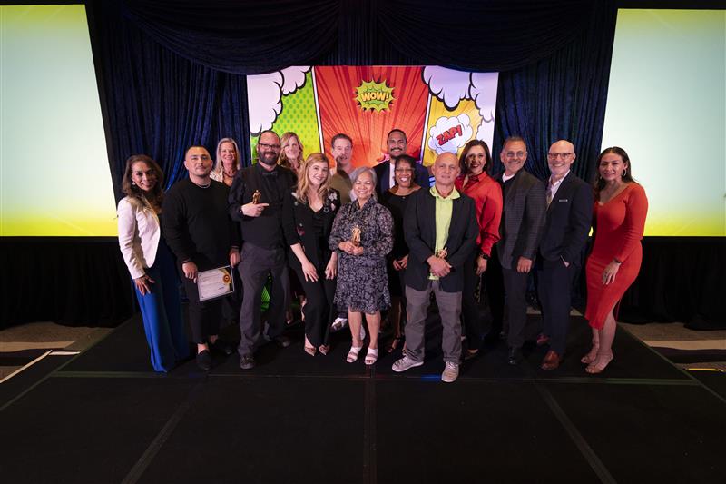 Super Hero picture from SAHARA showing team members that won an award and free trip