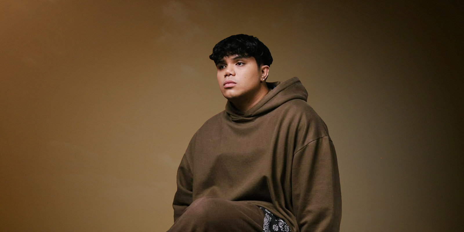 Dionela artist creative showing the singer siting down
